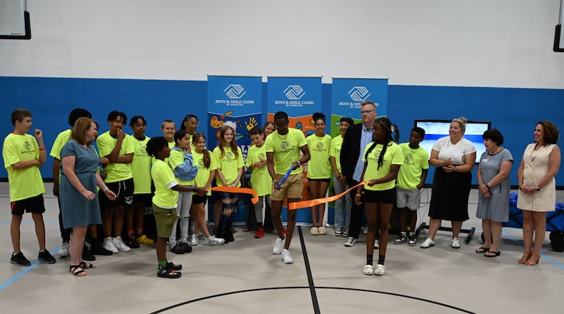With the state of potential state funding, the Boys and Girls Clubs of Hamilton celebrated the newly renovate gym floor of its Grand Boulevard location. Ohio Rep. Sara Carruthers, R-Hamilton, is pushing for the state to provide funding for the project, which has already passed the Ohio House. MICHAEL D. PITMAN/STAFF