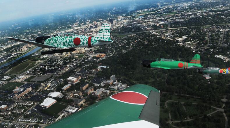 Flying with Tora, Tora Tora Air Show over Dayton Friday July, 29, 2022. the show will be performing at the Dayton Air Show this weekend.. MARSHALL GORBY\STAFF