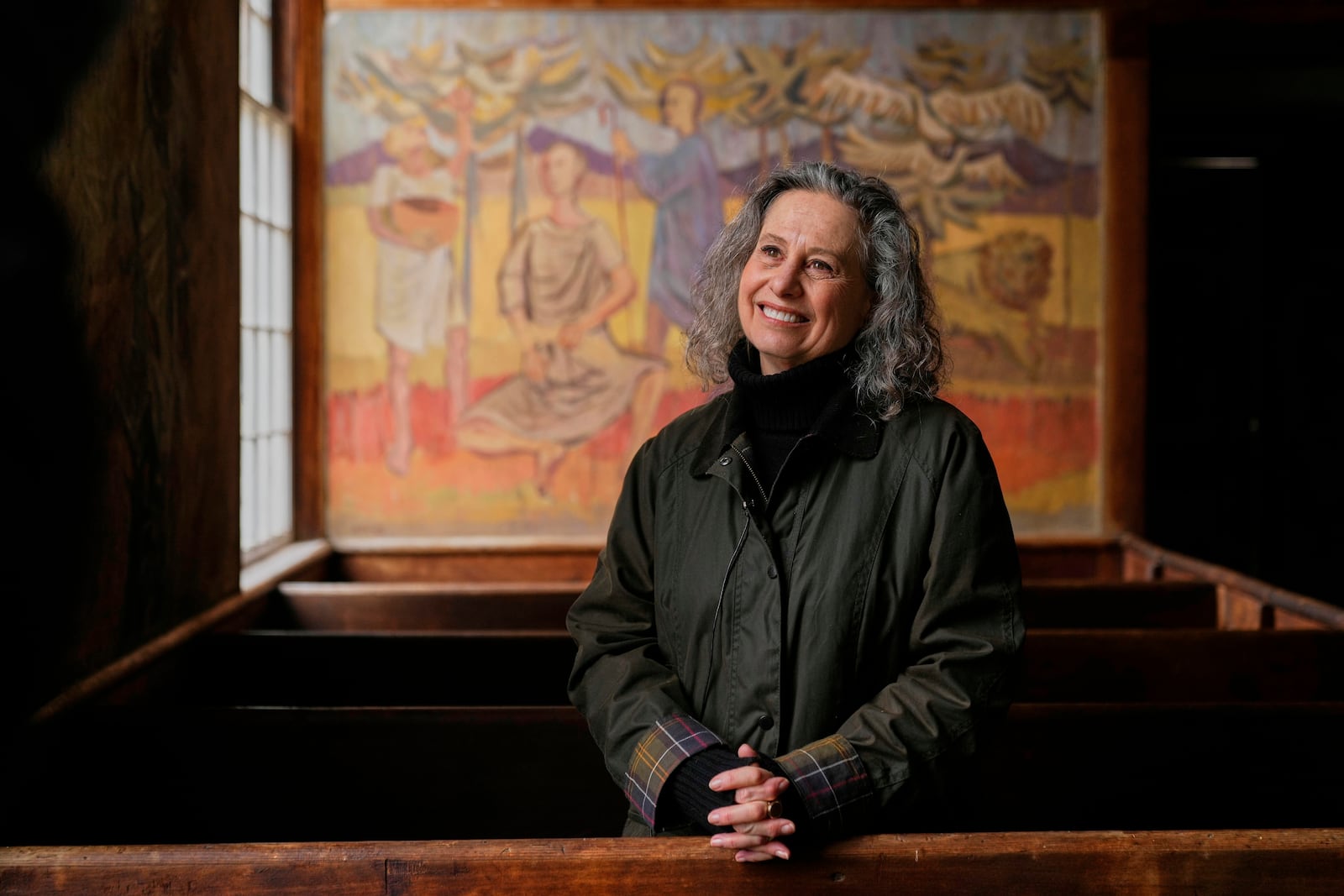 Veronique Plesch, an art professor at Colby College, pauses during a tour of the South Solon Meeting House, Sunday, April 6, 2025, in Solon, Maine. (AP Photo/Robert F. Bukaty)