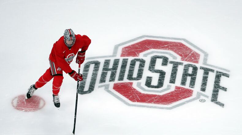 FILE - Ohio State University forward Ronnie Hein guides the puck during NCAA college hockey practice on April 4, 2018, in St. Paul. Minn. Several years into the new age of college sports, where athletes are allowed to profit from their successes through name, image and likeness deals, everyone is still trying to find out what the new normal will be. (Anthony Souffle/Star Tribune via AP, File)
