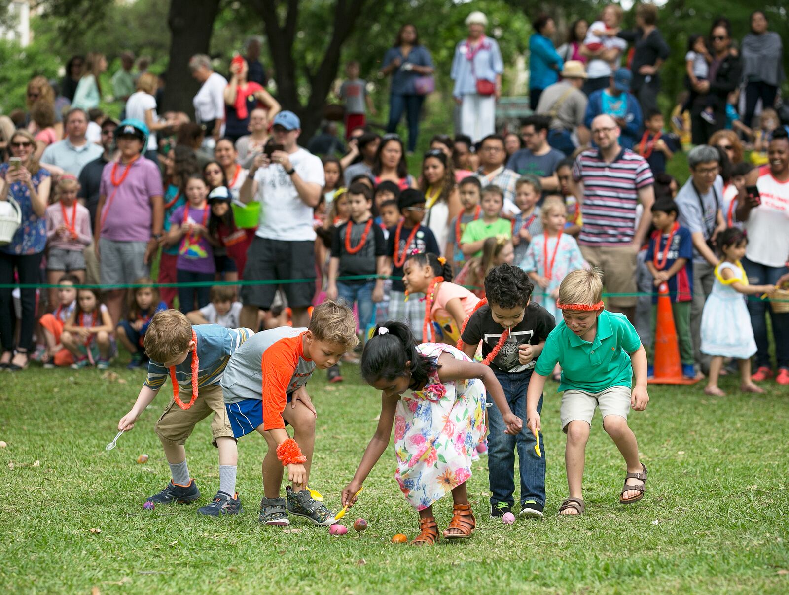 A group of children do their best to move an egg with a spoon during the egg roll at the First United Methodist Church's annual Easter egg hunt on the grounds of the state Capitol on Saturday, April 15, 2017.  Food was sold at the event with proceeds supporting First UMC's Eurasia Mission Team, and non-perishable food donations were taken for the Capital Area Food Bank. DEBORAH CANNON / AMERICAN-STATESMAN