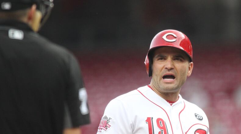 The Reds’ Joey Votto disputes a called strike three during a game against the Braves on Tuesday, April 23, 2019, at Great American Ball Park in Cincinnati. David Jablonski/Staff
