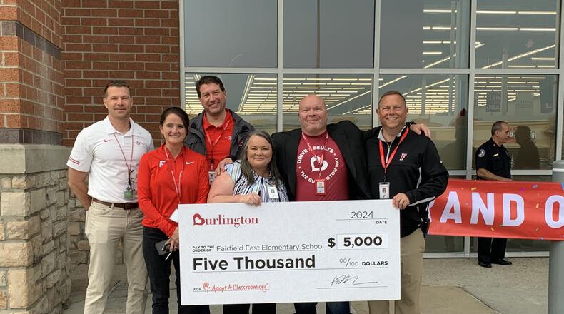 Fairfield East Principal Roxanna Woyat, center, is joined by school district officials Bill Rice, Kim Hauer, Lance Perry, Burlington District Manager Kevin Schock, and Fairfield Superintendent Billy Smith. Woyat was presented with a $5,000 grant from Burlington Stores and the AdoptAClassroom organization for teachers to purchase school supplies. CONTRIBUTED