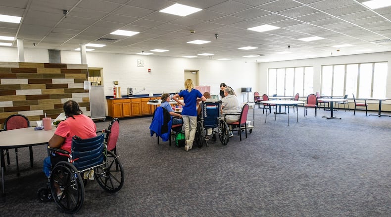 Residents play games in the partially renovated dining area at the Butler County Care Facility Tuesday, April 25 in Hamilton. NICK GRAHAM/STAFF