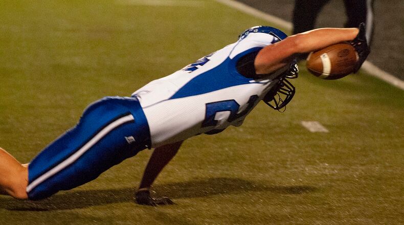 Brookville running back Sammy Daffler breaks through tackles to on a 15-yard run to reach the one. He scored on the next play for an early 6-0 lead Friday night at Franklin. Jeff Gilbert/CONTRIBUTED