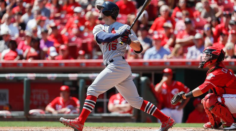 St. Louis Cardinals' Randal Grichuk hits a two-run home run off Cincinnati Reds starting pitcher Tim Adleman in the second inning of a baseball game, Sunday, Sept. 4, 2016, in Cincinnati. (AP Photo/John Minchillo)