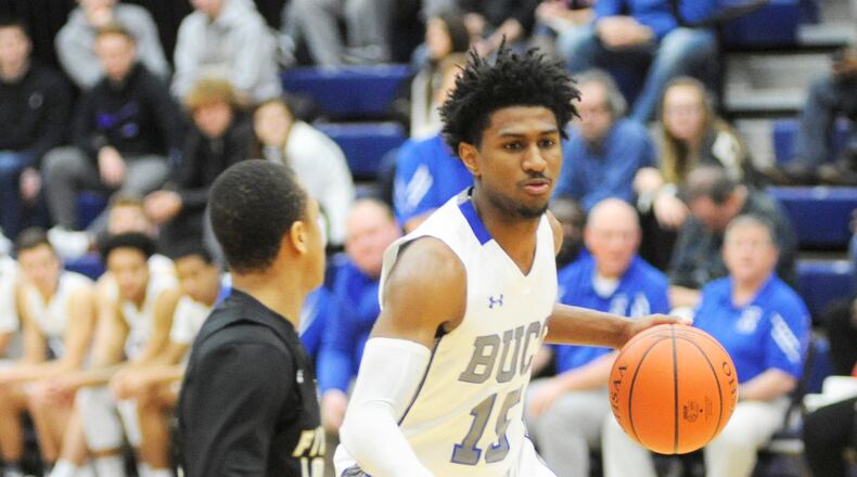 Xenia senior Samari Curtis (with ball), shown here at the Premier Health Flyin’ to the Hoop. MARC PENDLETON / STAFF