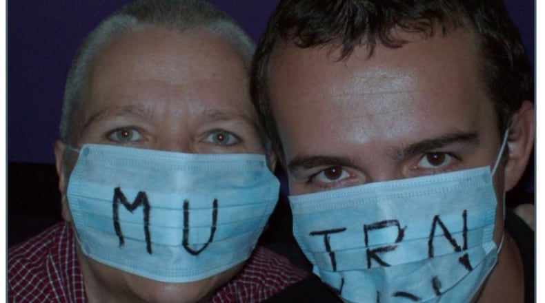Cheryl Heckler as her hair started to grow back following cancer treatment pictured with Jon Gambrell.