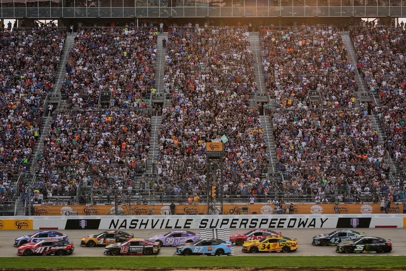 Drives speed past the green flag at the start of a NASCAR Cup Series auto race Sunday, June 1, 2025, in Lebanon, Tenn. (AP Photo/George Walker IV)