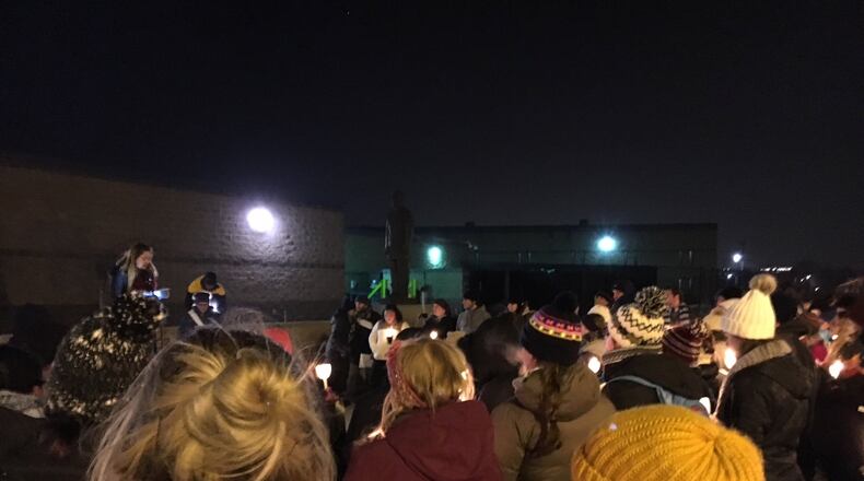 More than 100 people from throughout southwest Ohio braved freezing temperatures Monday night to attend a candlelight vigil raising awareness about human rights abuses committed in the name of immigration enforcement. The vigil, which lasted just over an hour, was held at the Butler County Jail which also houses an ICE detention facility. It was organized by several organizations affiliated with the University of Dayton. ED RICHTER/STAFF