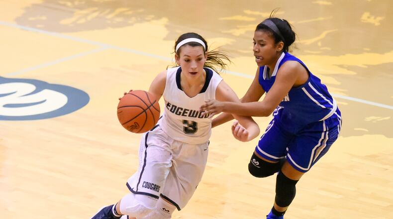 Edgewood’s Tori Childers dribbles the ball while being defended by Hamilton’s Alicia Arce during their game Nov. 25, 2016, at Edgewood. NICK GRAHAM/STAFF