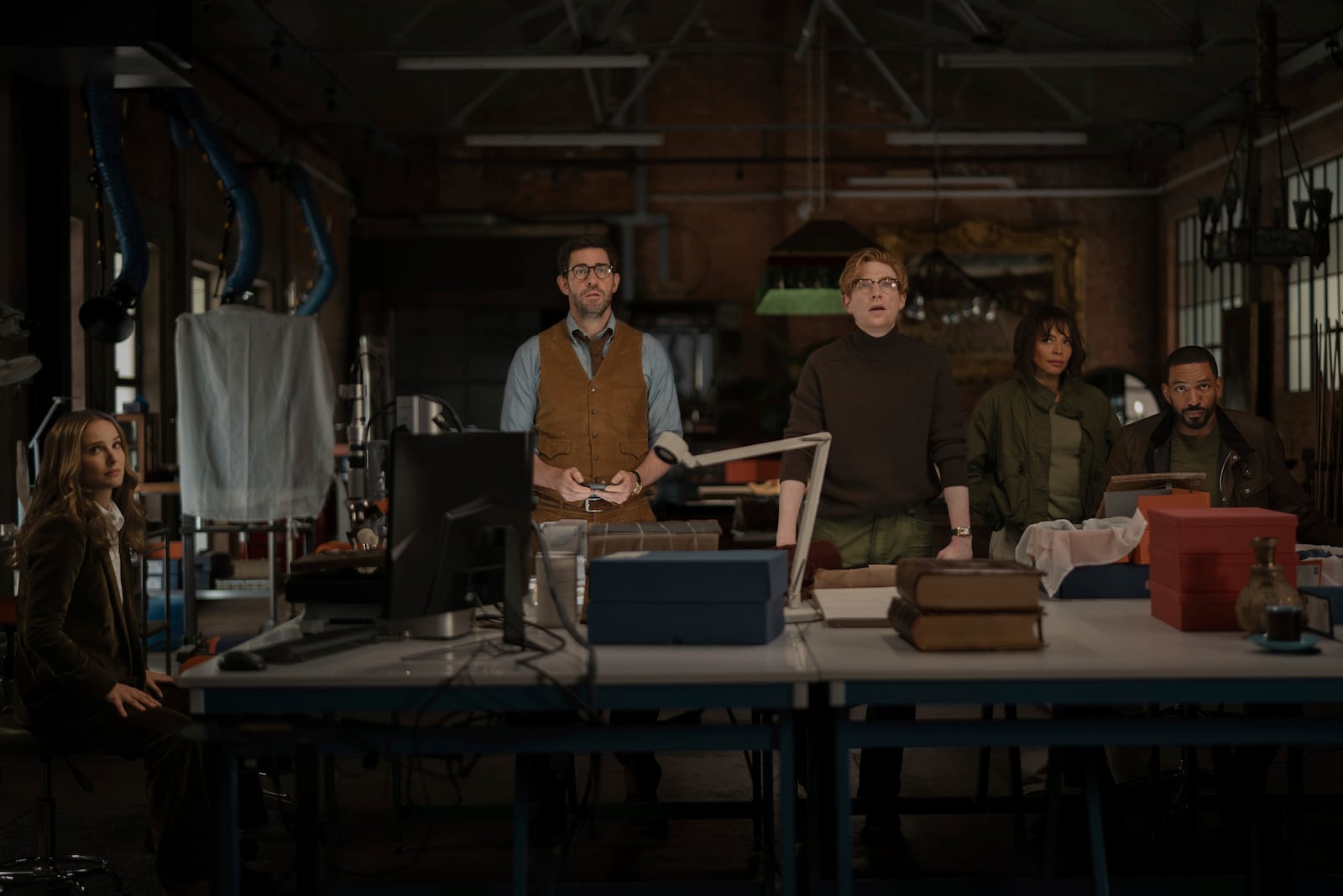 This image released by Apple TV+ shows Natalie Portman, from left, John Krasinski, Domhnall Gleeson, Carmen Ejogo, and Laz Alonso in a scene from the film "Fountain of Youth."(Christopher RaphaelApple TV+ via AP)
