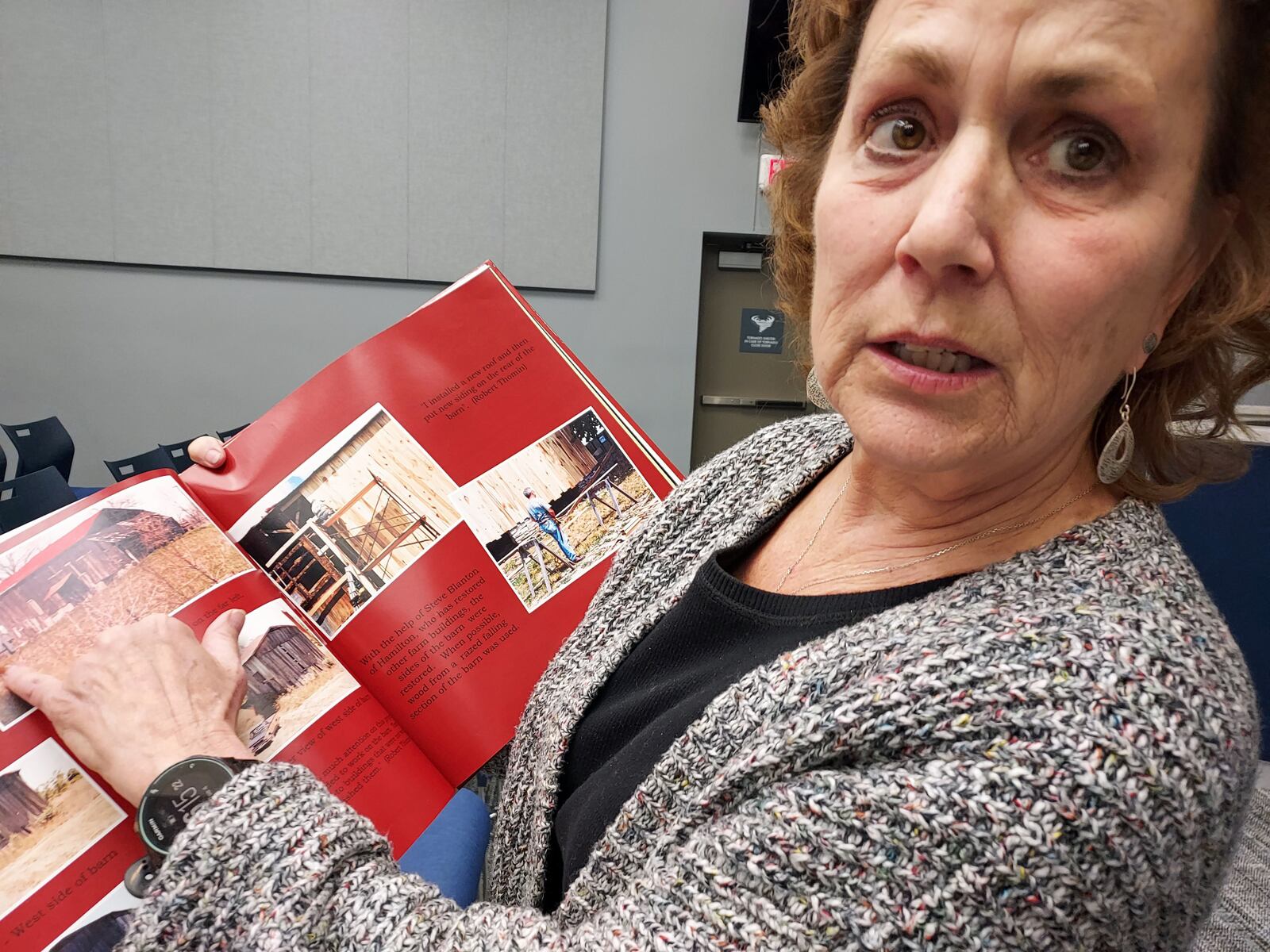 Amy Thomin Gross: Amy Thomin Gross reviews a scrapbook book together about property her brother Howard Thomin has donated to Liberty Twp. Photo: Sue Kiesewetter