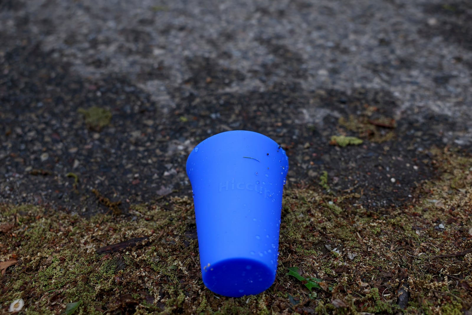 A used Hiccup, a reusable silicone cup, is discarded on the ground before being collected during the PNC Women Run the Cities race on Saturday, May 17, 2025, in Minneapolis. (AP Photo/Ellen Schmidt)