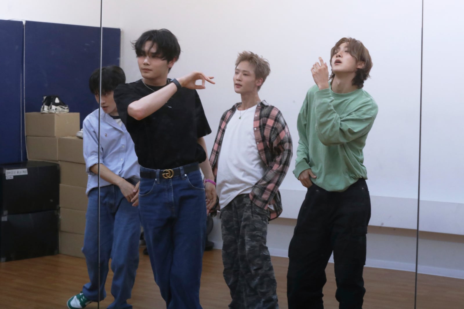 A mirror reflects K-pop band 1VERSE members practicing ahead of their upcoming debut show at a dance practice room at their label in Seoul, South Korea, Wednesday, July 16, 2025. (AP Photo/Juwon Park)