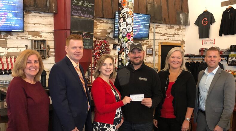 Grainworks Brewing Company donated $1,977 to Lakota Schools Foundation on Tuesday, Nov. 27, after five months of sales of Lakota Thunderbird-Red Ale. Pictured are: Lakota School Board member Kelly Casper; Lakota Superintendent Matt Miller; Community Foundation of West Chester/Liberty President & CEO Erin Clemons; Grainworks Brewing Company Founder and COO Steven Brock; Lakota School Board President Julie Shaffer; and Lakota School Board Vice President Brad Lovell.