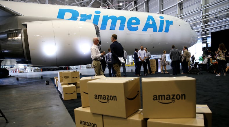 Amazon.com boxes are shown stacked near a Boeing 767 Amazon “Prime Air” cargo plane on display in August 2016 in a Boeing hangar in Seattle. AP Photo/Ted S. Warren