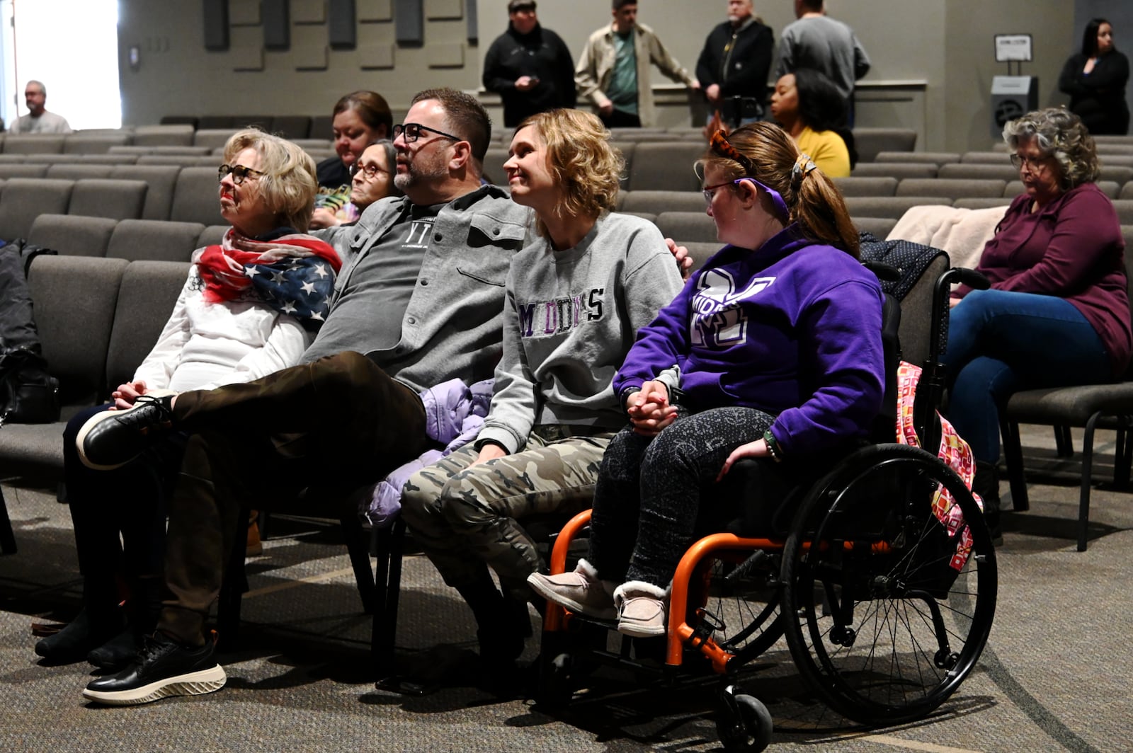 A little more than a dozen people attended the Trump Vance inauguration watch party on Monday, Jan. 20, 2025, at Berachah Church in Middletown, Ohio. Many are parents of the Middletown High School marching band, which was invited to attend the inauguration by Vice President JD Vance, a native Middletonian. Pictured is Berachah Church lead pastor Lamar Ferrell and his family watching the inauguration coverage. MICHAEL D. PITMAN/STAFF