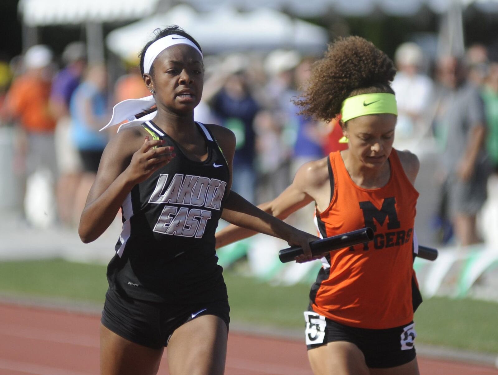 Jasmine Floyd (left) anchored Lakota East’s 400 relay squad to a second-place finish Saturday during the Division I state track and field meet at Ohio State University’s Jesse Owens Memorial Stadium in Columbus. MARC PENDLETON/STAFF
