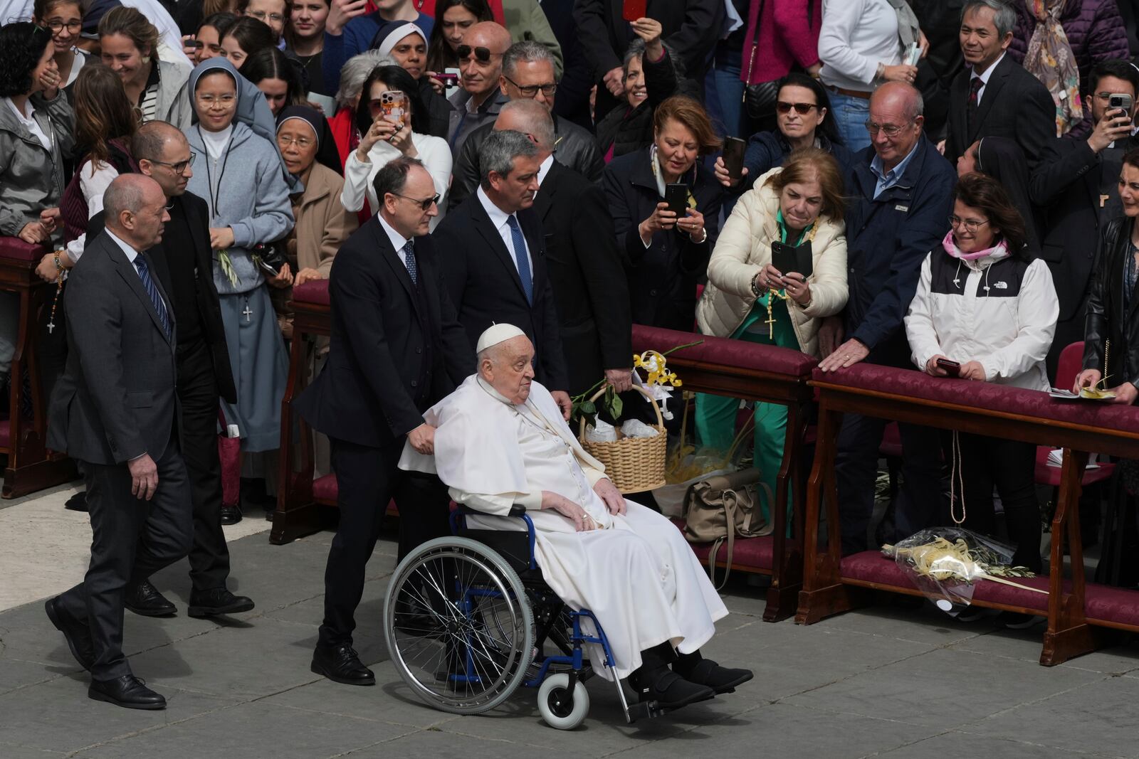 Pope Francis arrives at the end of the mass on Palm Sunday in St. Peter's Square at The Vatican, Sunday, April 13, 2025. (AP Photo/Alessandra Tarantino)