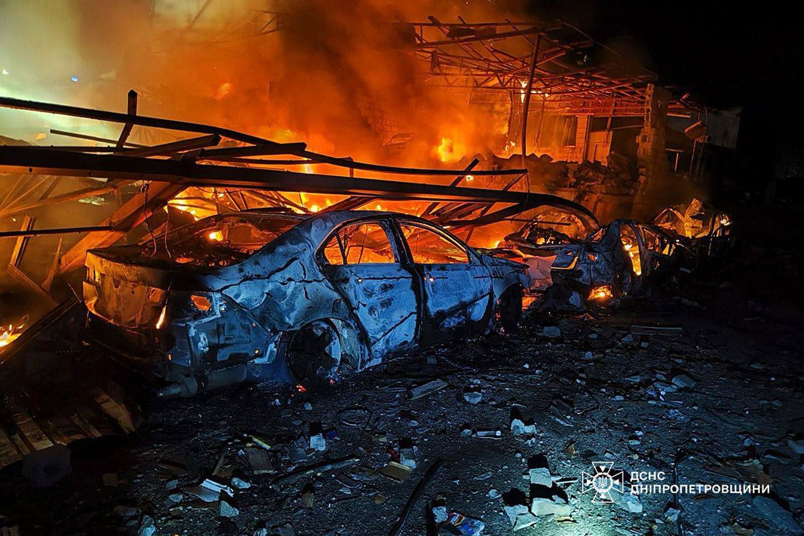In this photo provided by the Ukrainian Emergency Service, firefighters put out the fire following Russia's drones attack in Kamianske, Dnipropetrovsk region, Ukraine, Wednesday, April 16, 2025. (Ukrainian Emergency Service via AP)