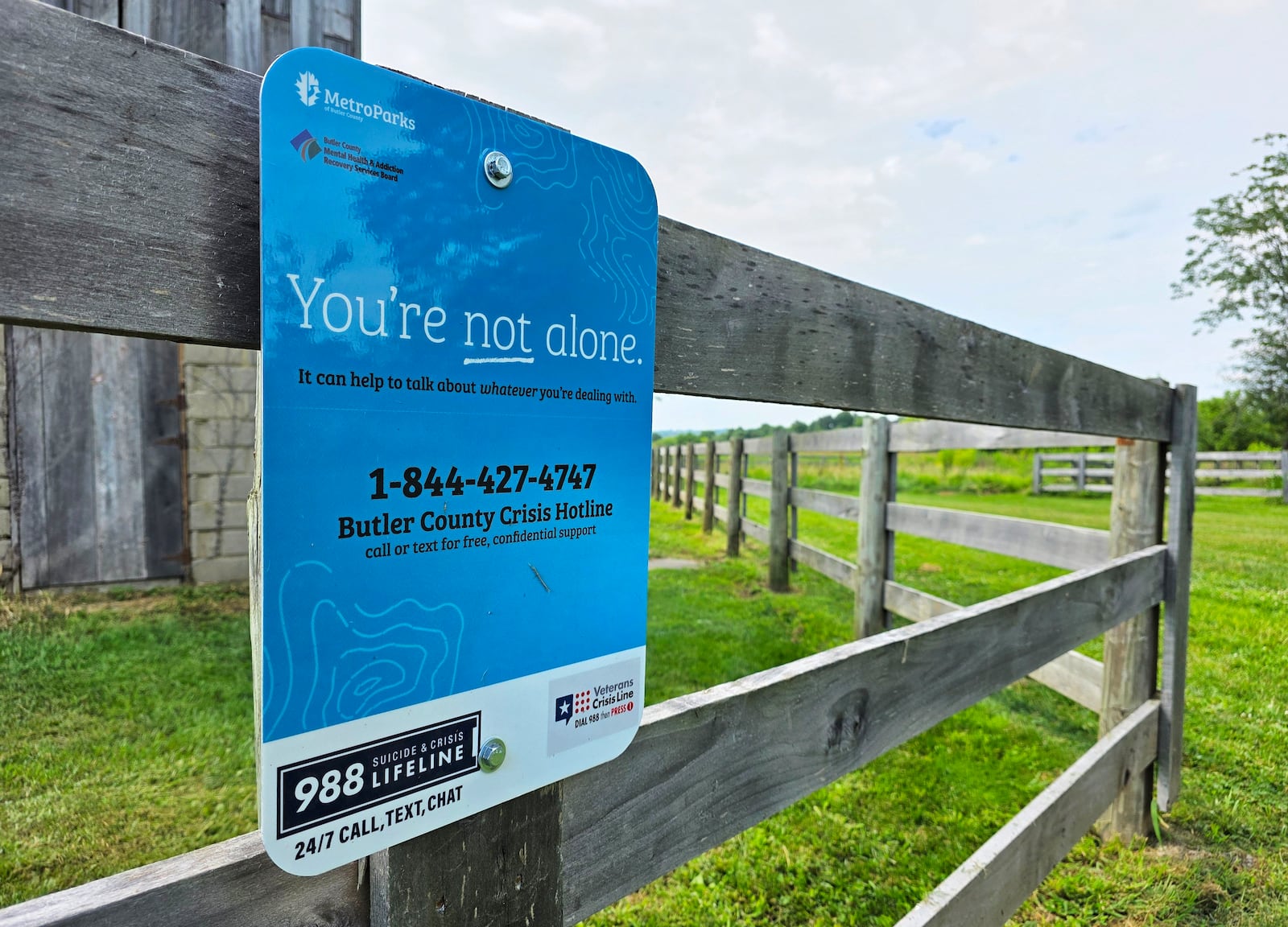 MetroParks and Butler County MHARS board have placed suicide prevention and addiction resource signage throughout the 23 MetroParks in Butler County. A total 24 signs were installed in July. NICK GRAHAM / STAFF