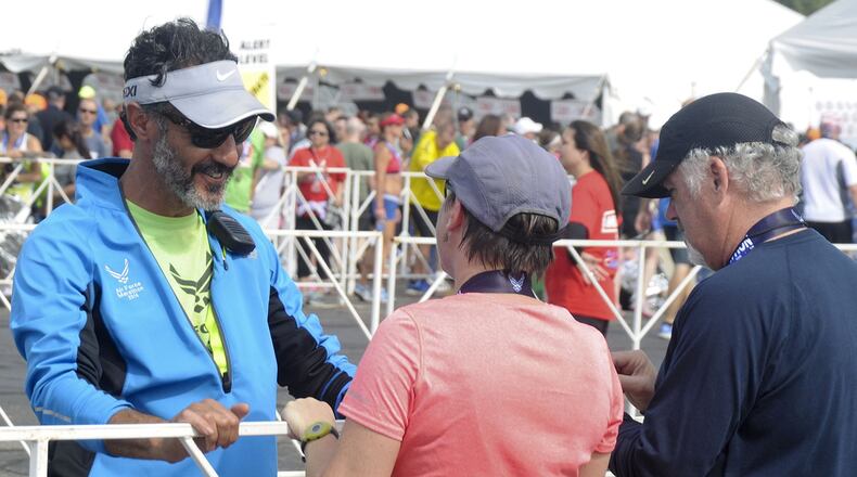 Former Air Force Marathon Director Rob Aguiar (at left, in blue jacket) at a past marathon. CONTRIBUTED