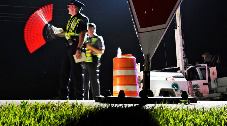 Officers from Monroe, Middletown and the Ohio State Highway Patrol participated in an OVI checkpoint Early Saturday morning, June 11, 2011 along OH-4 in Monroe, Ohio. Staff photo by Nick Graham