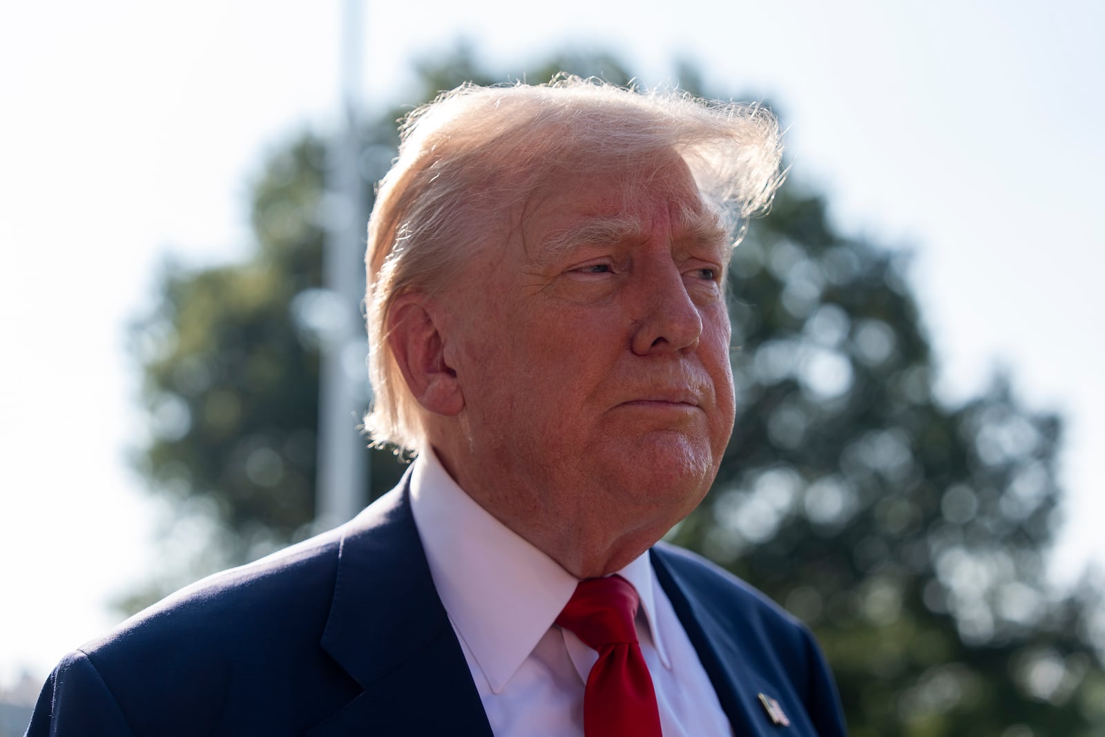 President Donald Trump speaks with reporters before departing on Marine One from the South Lawn of the White House, Friday, July 25, 2025, in Washington. (AP Photo/Alex Brandon)