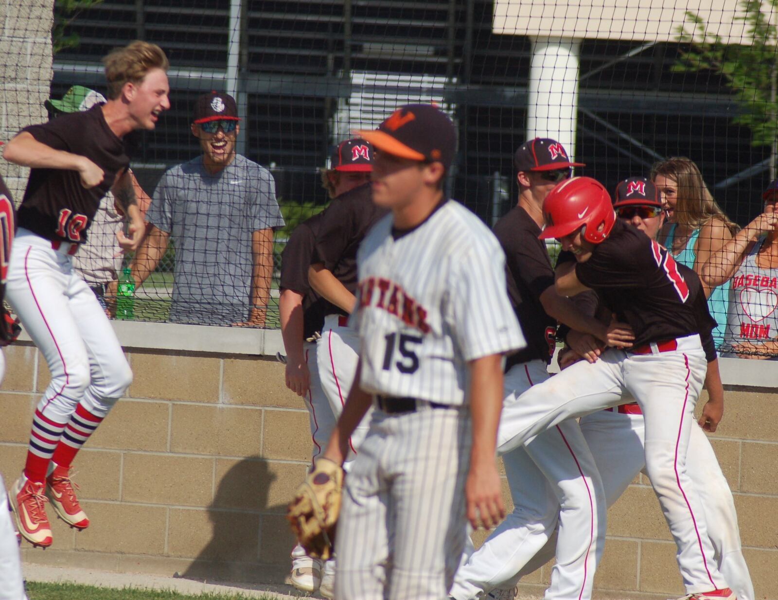 The Madison Mohawks celebrate one of their five runs in the second inning Thursday during a Division II sectional final against Waynesville at Eaton. CONTRIBUTED PHOTO BY JOHN CUMMINGS