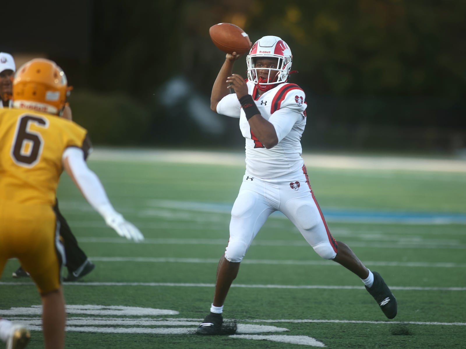Trotwood-Madison's Dallas Shehee throws a pass against Alter on Friday, Sept. 12, 2025, at Roush Stadium in Kettering. David Jablonski/Staff