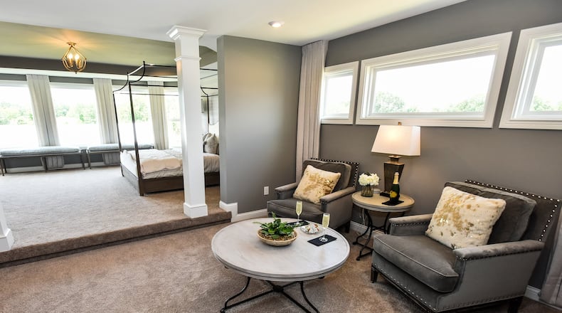The Marshall by Fischer Homes is one of ten custom homes available for viewing during the Home Builders Association of Greater Cincinnati Homearama 2019 in the Kensington neighborhood in Deerfield Township in Warren County. The show runs June 8-23. This is a seating area within the master suite. NICK GRAHAM/STAFF