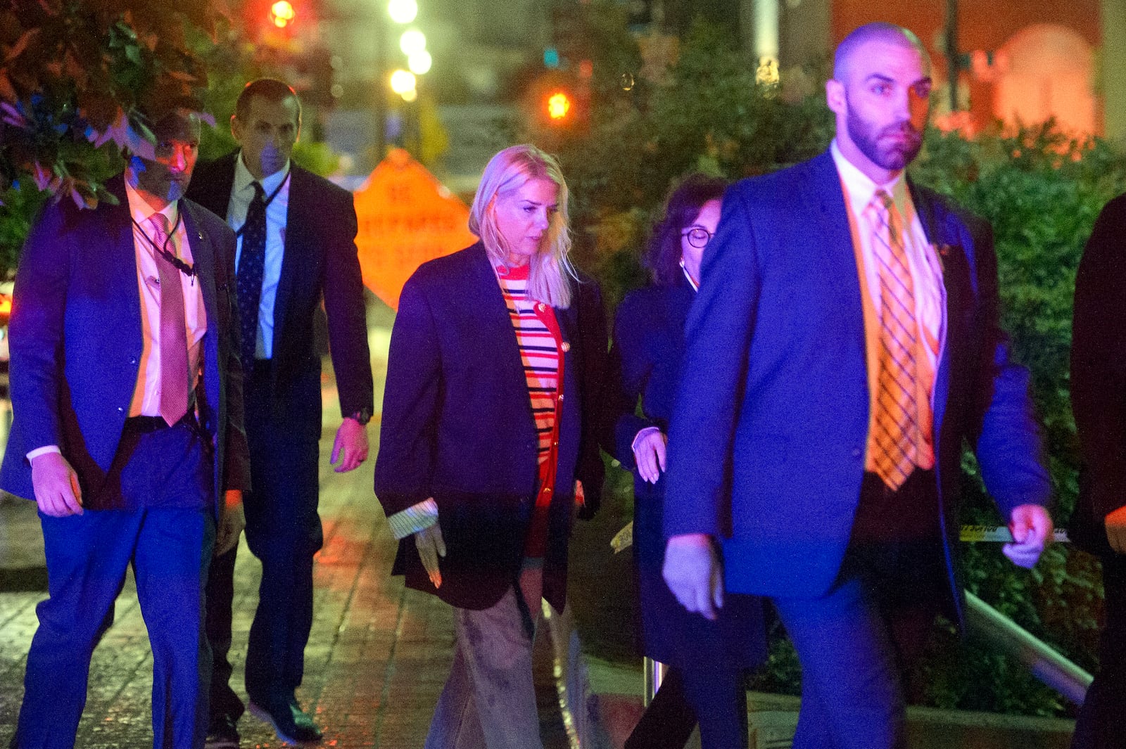 Attorney General Pam Bondi, center, walks to her car as law enforcement work the scene after two staff members of the Israeli Embassy in Washington were shot and killed outside the Capital Jewish Museum, Thursday, May 22, 2025, in Washington. (AP Photo/Rod Lamkey, Jr.)