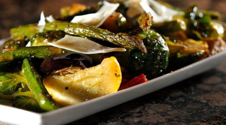 A plate of fresh season vegetables, a mix of asparagus, brussels sprouts, squash, zucchini, eggplant and peppers at The Amber Rose Restaurant and Catering. LISA POWELL / STAFF FILE PHOTO