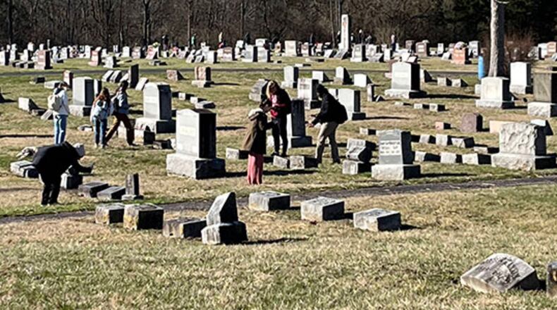 Some Miami University students have turned an historic cemetery here into an extension of their classroom. Starting with fall semester last year, students in the school’s Advanced Geographic Information Systems (GIS) program began working on mapping Oxford Cemetery as part of their studies. Pictured are Miami students work on mapping Oxford Cemetery, which dates to 1855. CONTRIBUTED