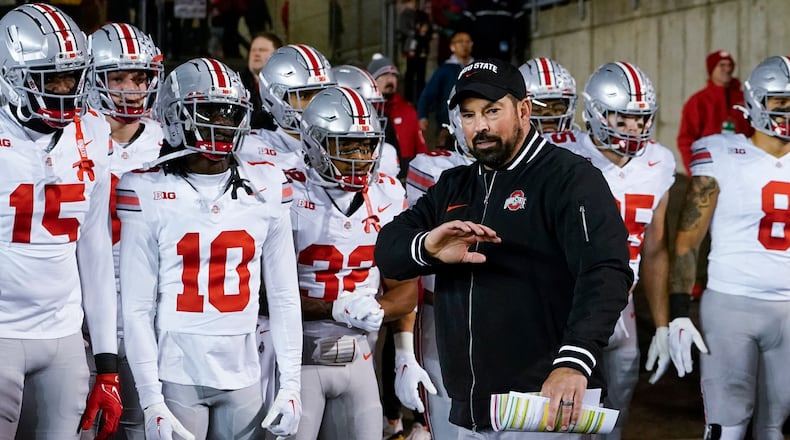Ohio State head coach Ryan Day leads his team on the field before an NCAA college football game against Wisconsin Saturday, Oct. 28, 2023, in Madison, Wis. (AP Photo/Morry Gash)