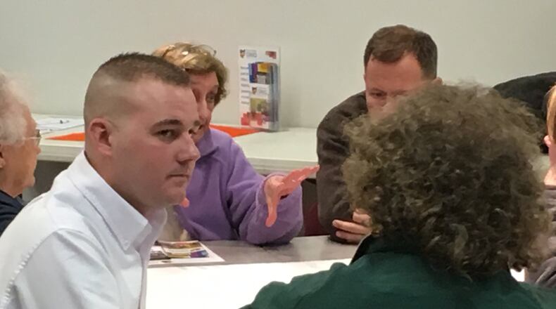 Franklin City Councilman Brent Centers listens to thoughts from resident Sky Stewart on ideas on how revitalize downtown Franklin. Community stakeholders, city officials and representatives from Heritage Ohio met for two days to assess the viability of the downtown area to eventually become a Main Street community. ED RICHTER/STAFF