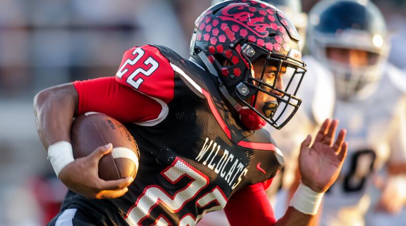 Franklin’s Ryan Montgomery carries the ball during a game against Valley View on Sept. 23 at Veterans Memorial Field at Atrium Stadium in Franklin. NICK GRAHAM/STAFF