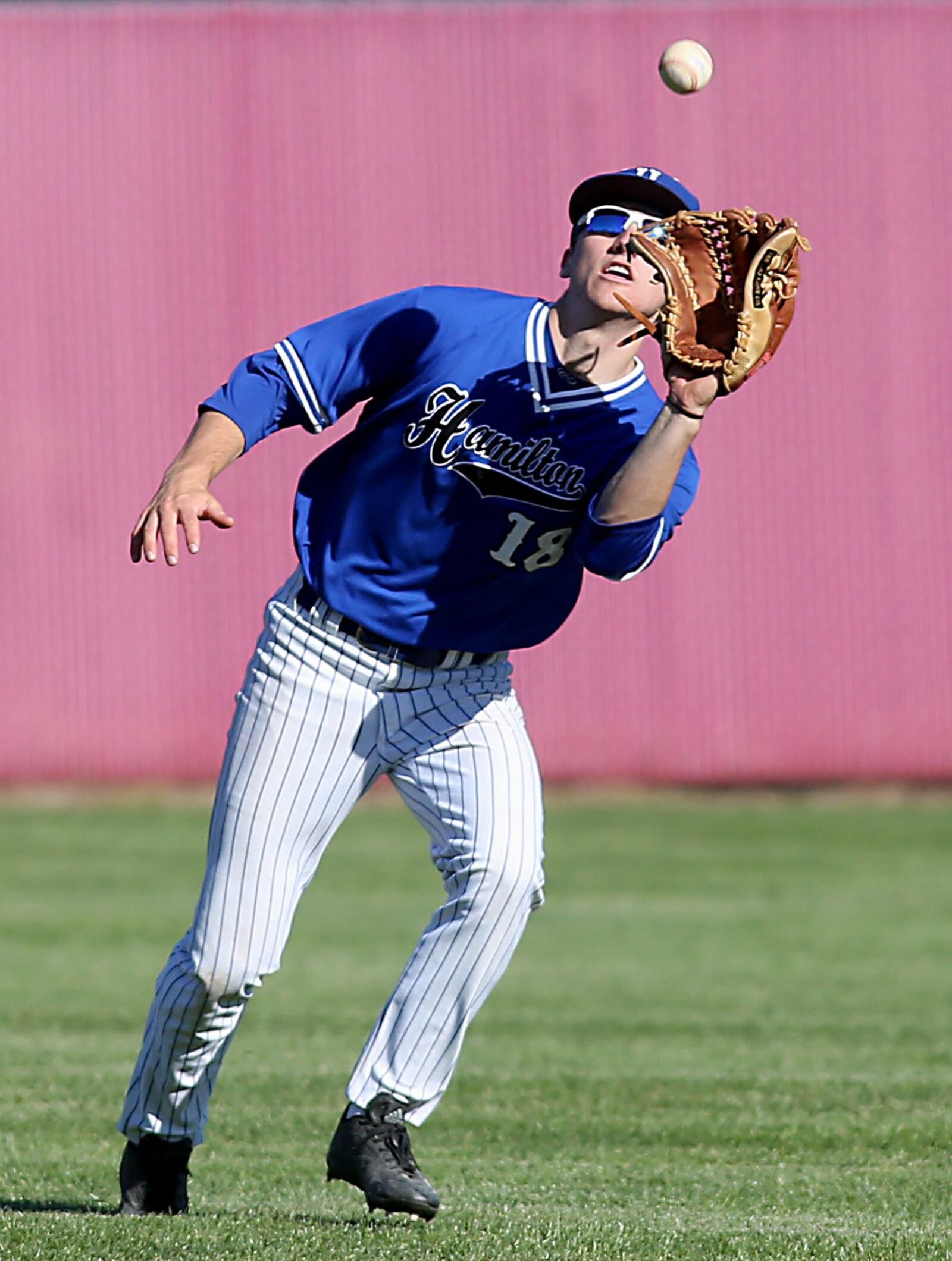 Hamilton center fielder Reid Ruhl hauls in a Fairfield fly ball during Sunday’s game at Joe Nuxhall Field in Fairfield. CONTRIBUTED PHOTO BY E.L. HUBBARD