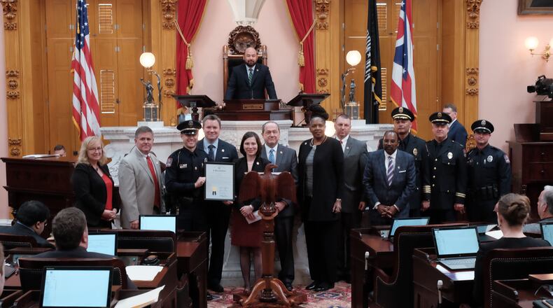 The Ohio House of Representatives on Wednesday, June 21, 2017, honored Ohio State University police officer Alan Horujko (holding resolution) for his actions during the fall 2016 campus attack. CONTRIBUTED