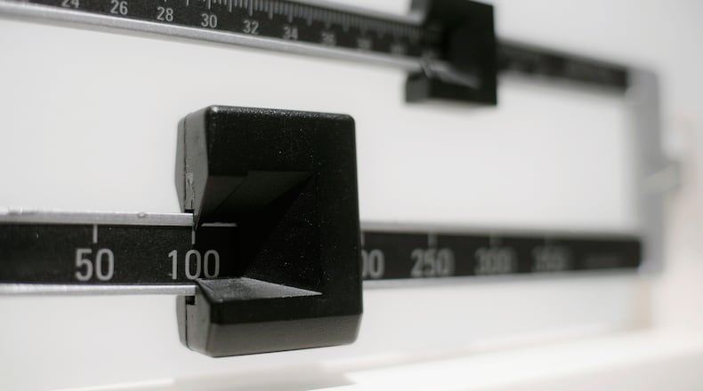 FILE - This April 3, 2018 file photo shows a closeup of a beam scale in New York. (AP Photo/Patrick Sison, File)