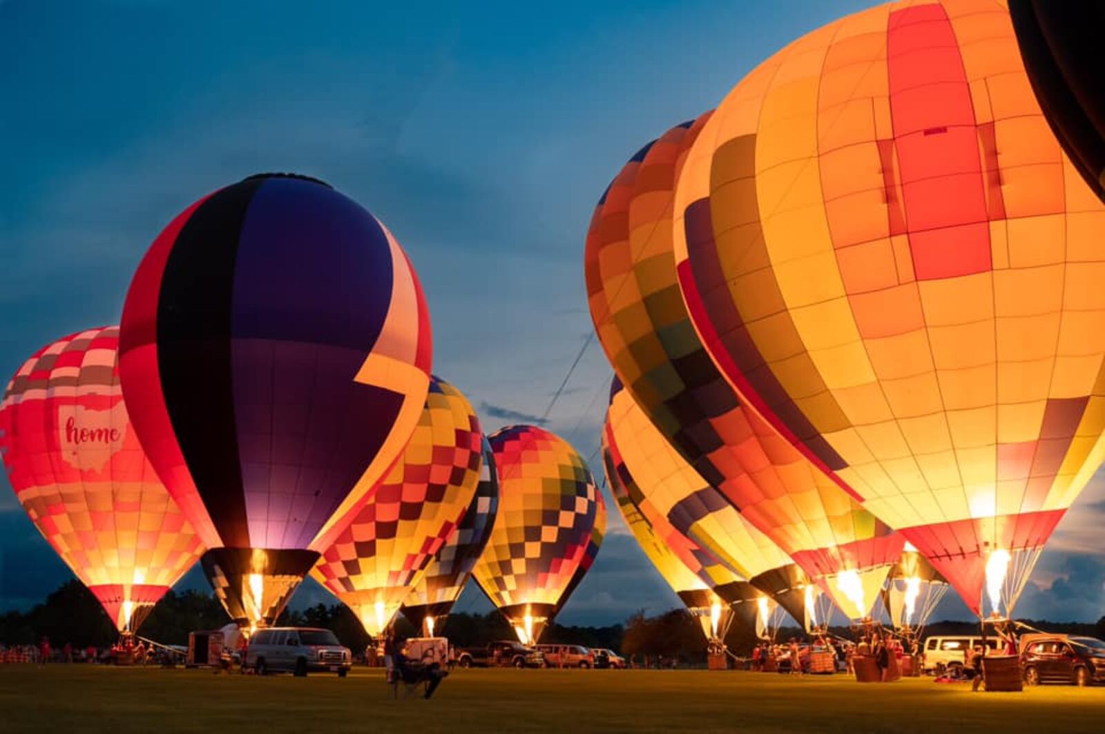 Several balloonists perform a balloon glow Saturday night during the 18th annual Ohio Challenge at Smith Park in Middletown. SUBMITTED PHOTO