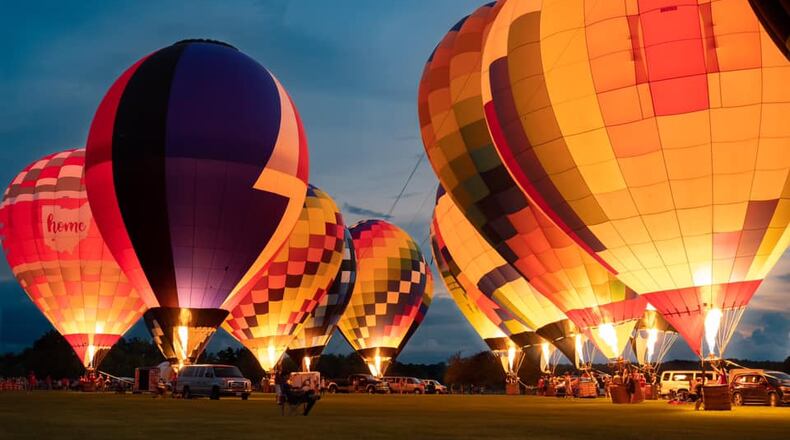 Several balloonists perform a balloon glow during the 18th annual Ohio Challenge at Smith Park in Middletown. SUBMITTED PHOTO