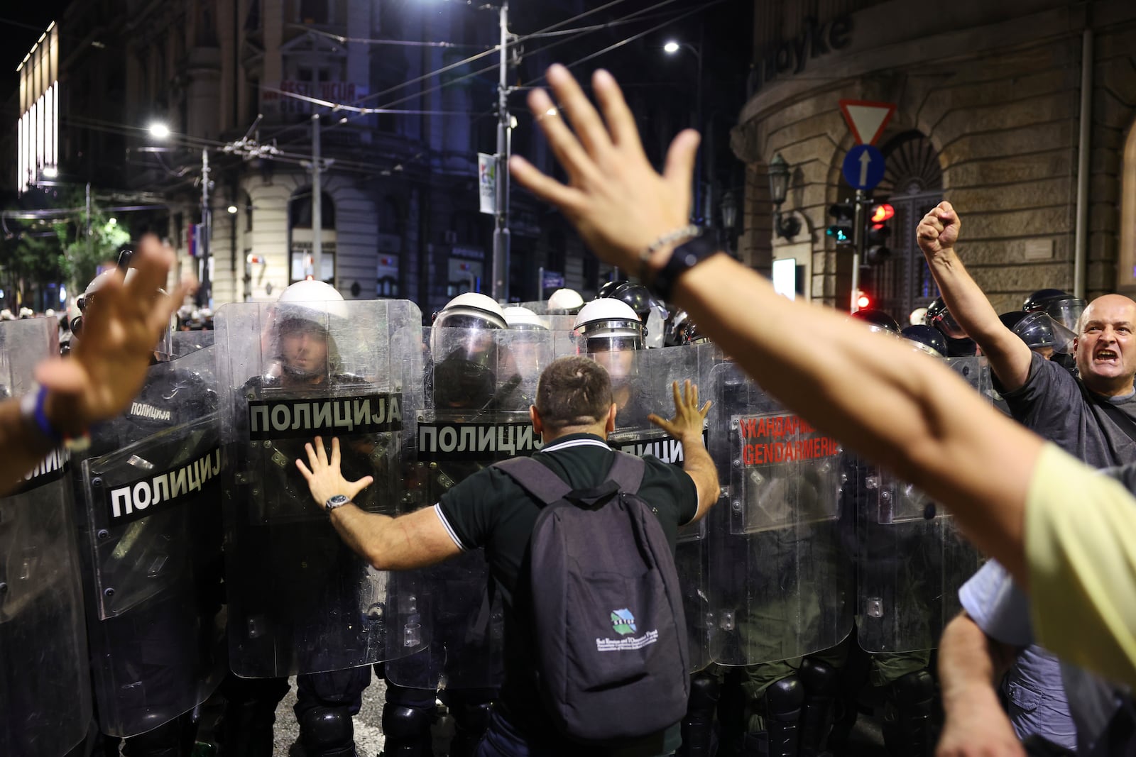 Riot police take positions on a street during a major anti-government rally pressing for an early election after nearly eight months of almost daily anti-corruption demonstrations that have shaken the populist government of President Aleksandar Vucic, in Belgrade, Serbia, Saturday, June 28, 2025. (AP Photo/Marko Drobnjakovic)
