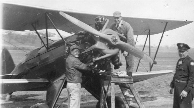 Brothers Art, Bernie and Joe pose outside a Waco 10 aircraft. The Waco 10 was the first family plane, purchased in 1932. CONTRIBUTED