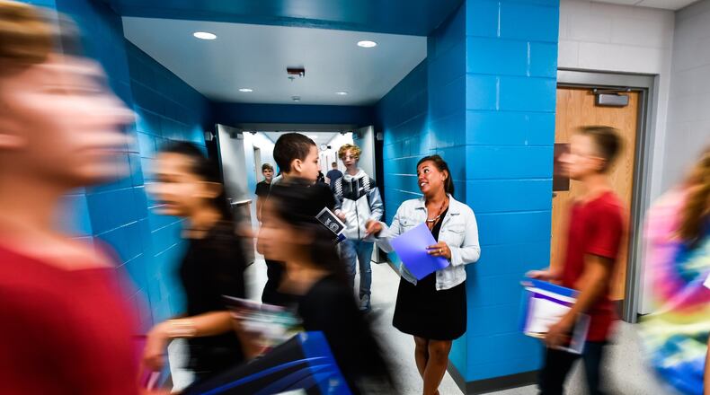 The 2024 PreventionFirst! biennial student survey indicated signs of improvements when it comes to kids interactions with substance use and their mental wellness, but there are improvements still needed. In this 2017 Journal-News photo, Intervention Specialist Dawn Schneider helps students find their classes in the hallway on the first day of classes at the new Fairfield Freshman School on Tuesday, Sept. 5, 2017, in Fairfield. NICK GRAHAM/FILE