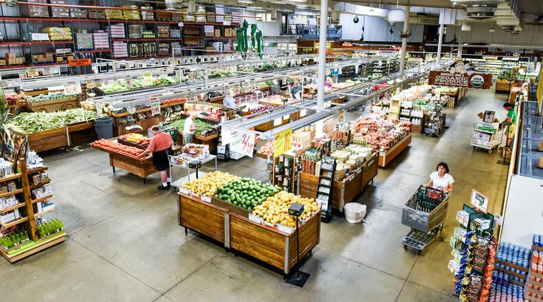 Customers shop in the produce section at Jungle Jim’s International Market in Fairfield. NICK GRAHAM/STAFF FILE PHOTO