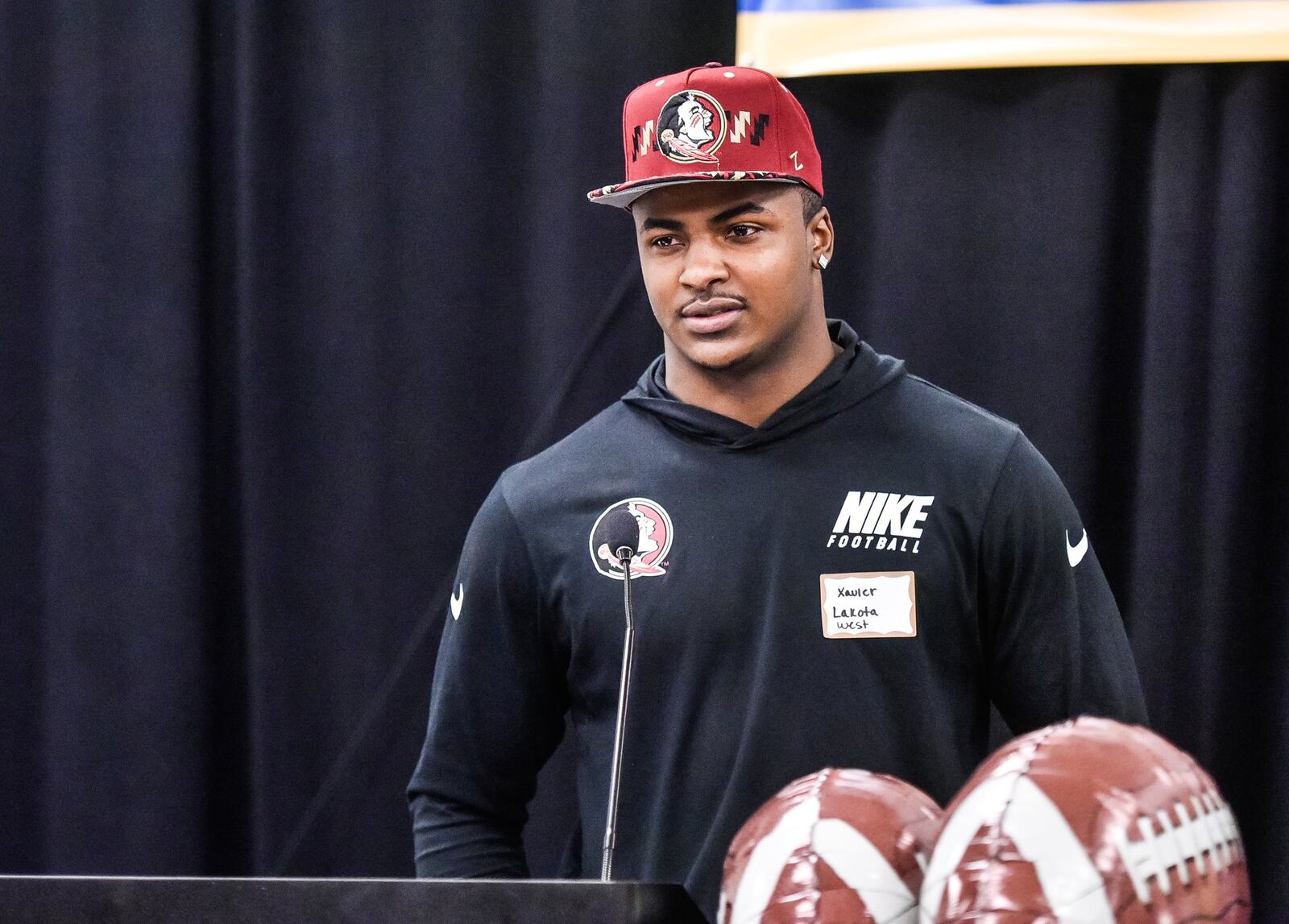 Lakota West senior Xavier Peters introduces himself during the Greater Miami Conference Signing Day event Wednesday at the Sharonville Convention Center. Peters signed with Florida State after decommitting from Kentucky. NICK GRAHAM/STAFF