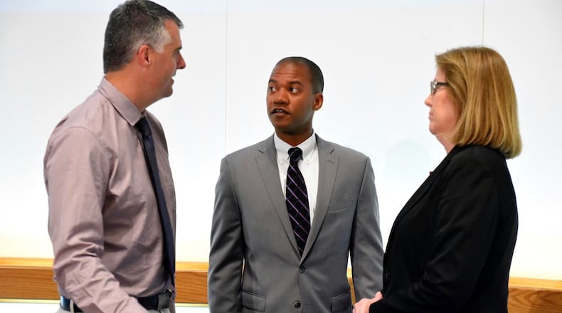 The Middletown City School District Board of Education announced during their meeting Monday night, May 22, that Marlon Styles, Jr. (middle) will be the new superintendent of the school district. Styles speaks with school board president Chris Urso, left, and vice president Marcia Andrews after the announcement.