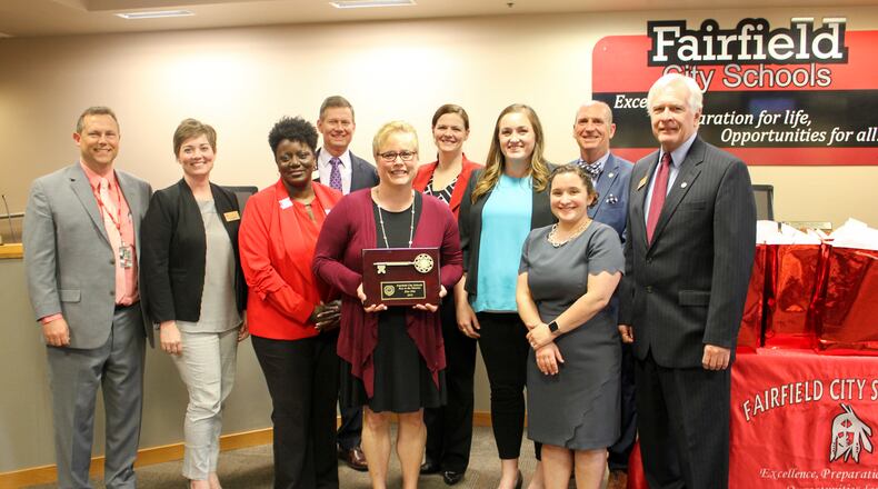 The Fairfield Board of Education, pictured here presenting a recent award to officials from Creekside Middle School, is moving fast to fill a board vacancy created by the recent resignation of board Vice President Dan Hare. The board has until June 6 to appoint a new board member, who will serve out the remainder of Hare’s term through Dec. 31.